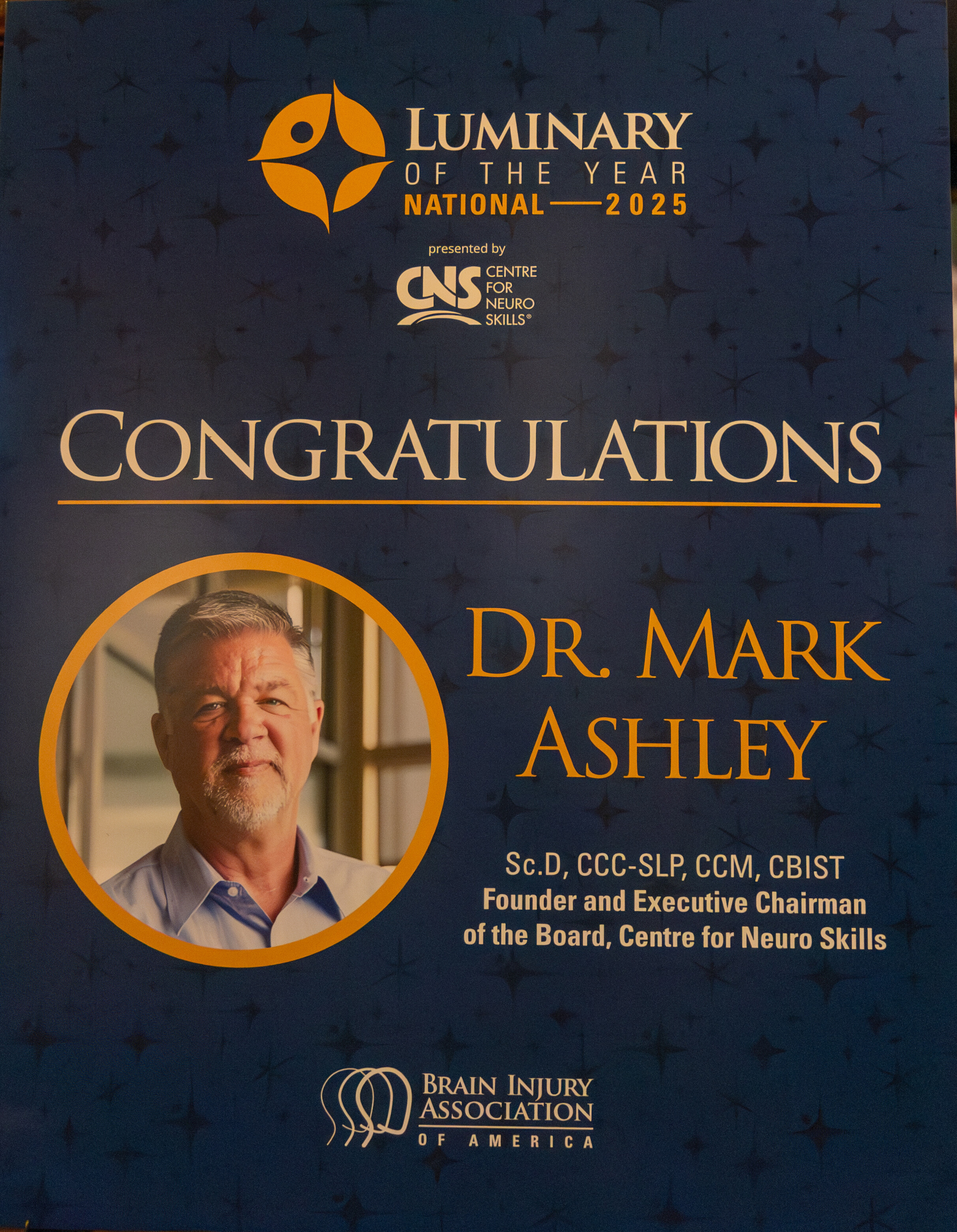 Poster congratulating Dr. Mark Ashley as 2025 National Luminary of the Year